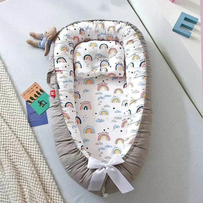 reducteur-de-lit-bebe-arc-en-ciel-transportable