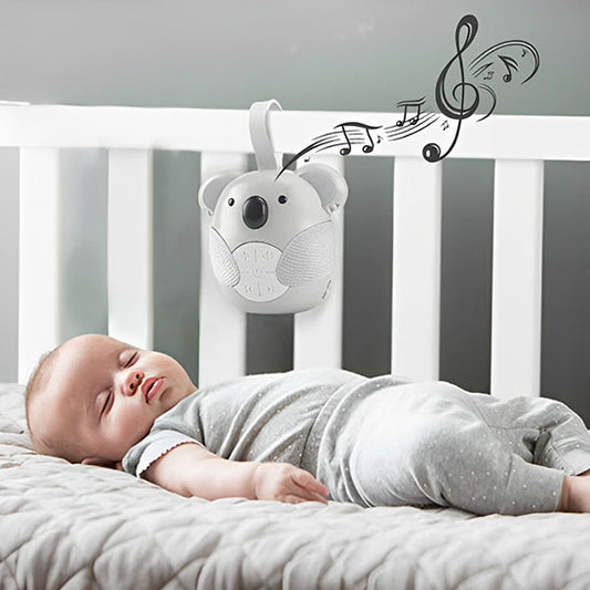 bebe-dort-avec-machine-a-bruit-blanc-koala-accroche-au-lit