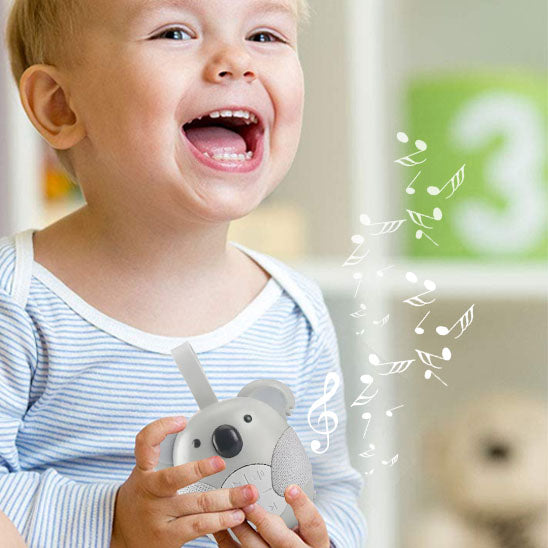 bebe-heureux-avec-veilleuse-bruit-blanc-koala