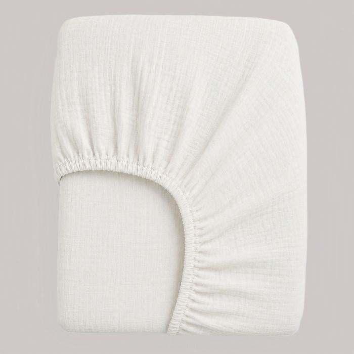 drap housse bébé gaze de coton blanc plié avec élastques