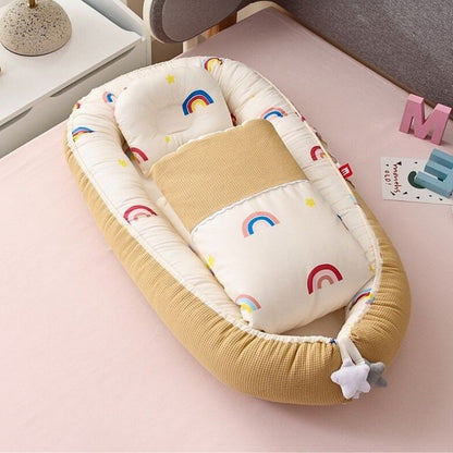 reducteur-de-lit-bebe-nestea-arc-en-ciel